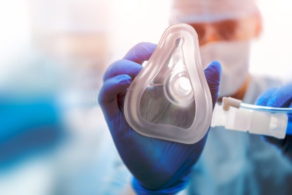 Doctor,Puts,On,Oxygen,Mask.,Emeregency,And,First,Aid,Concept. Doctor,Puts,On,Oxygen,Mask.,Emeregency,And,First,Aid,Concept.