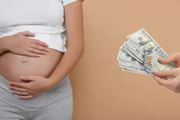 Surrogacy.,Intended,Mother,With,Money,And,Pregnant,Woman,On,Beige